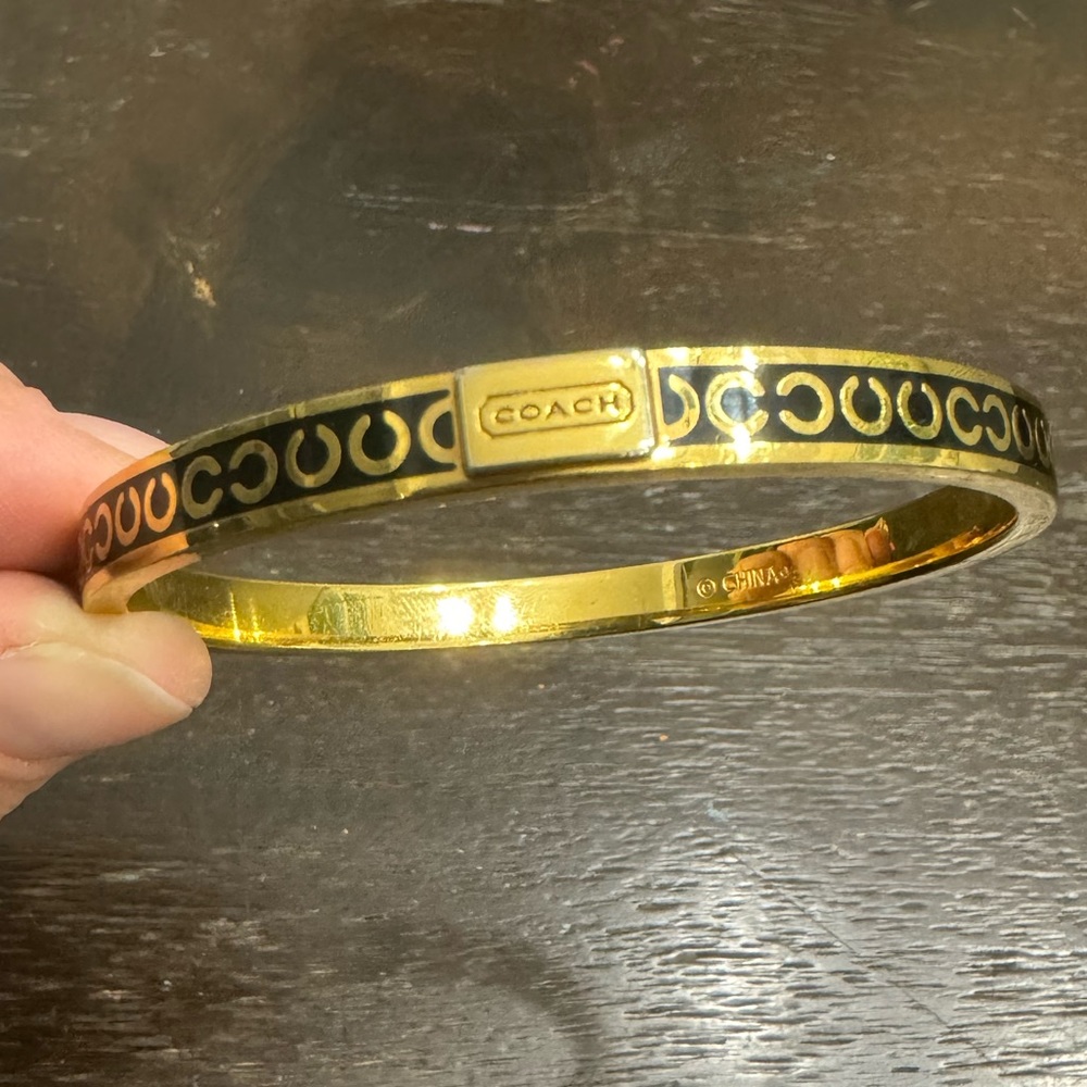 Lovely gold and black Coach bangle! Classy double c logo!